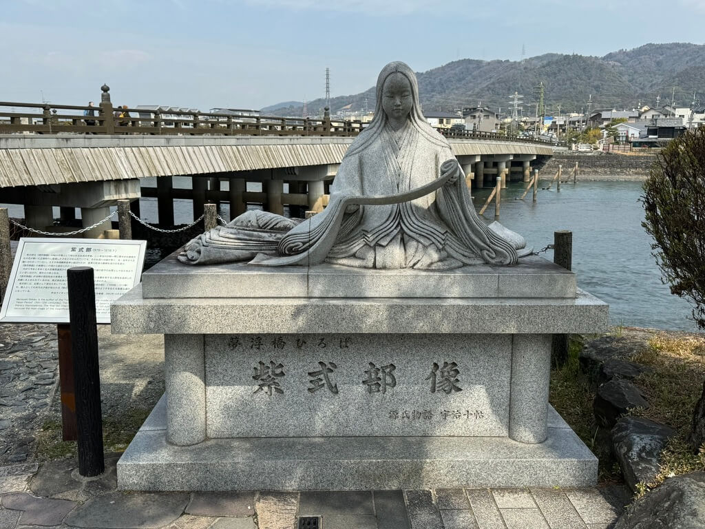 statue-of-a-woman-in-traditional-japanese-clothing-on-a-bridge.jpg