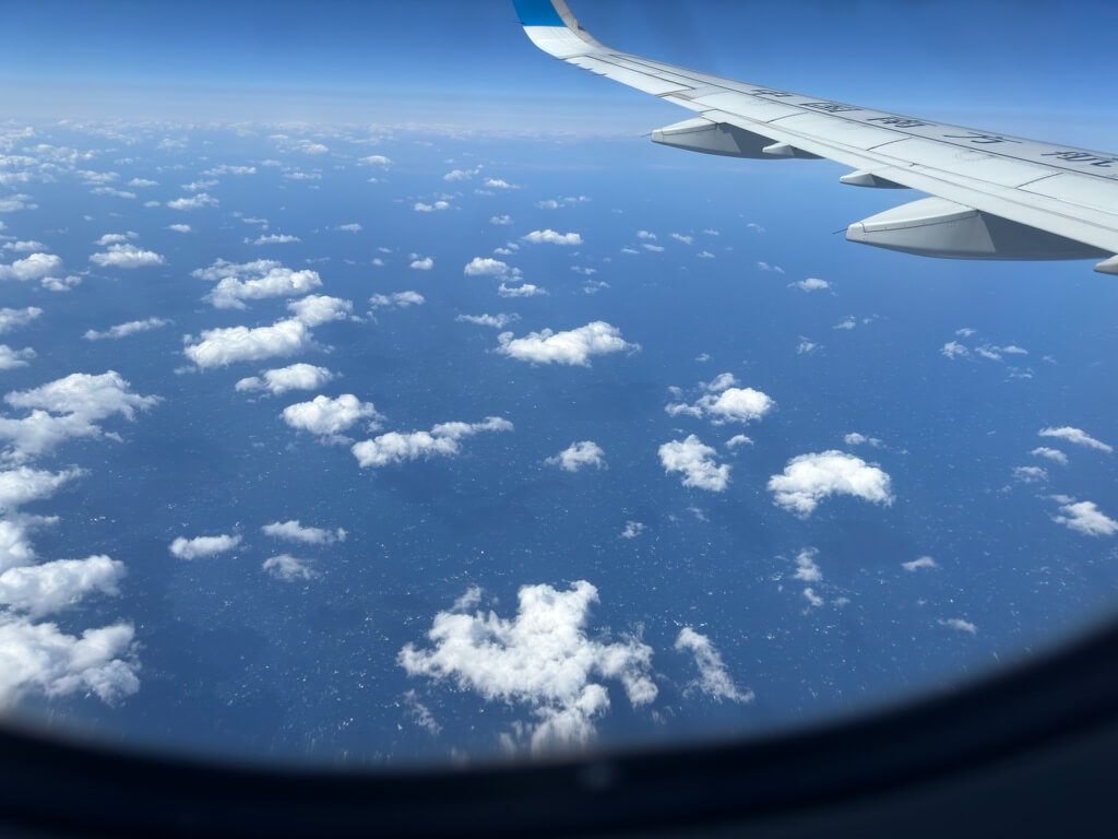window-seat-view-of-the-sky-and-clouds-from-an-airplane